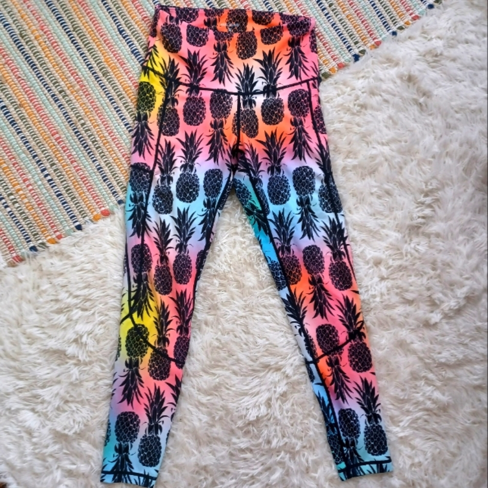 Feed me Fight me multi color pineapple leggings.